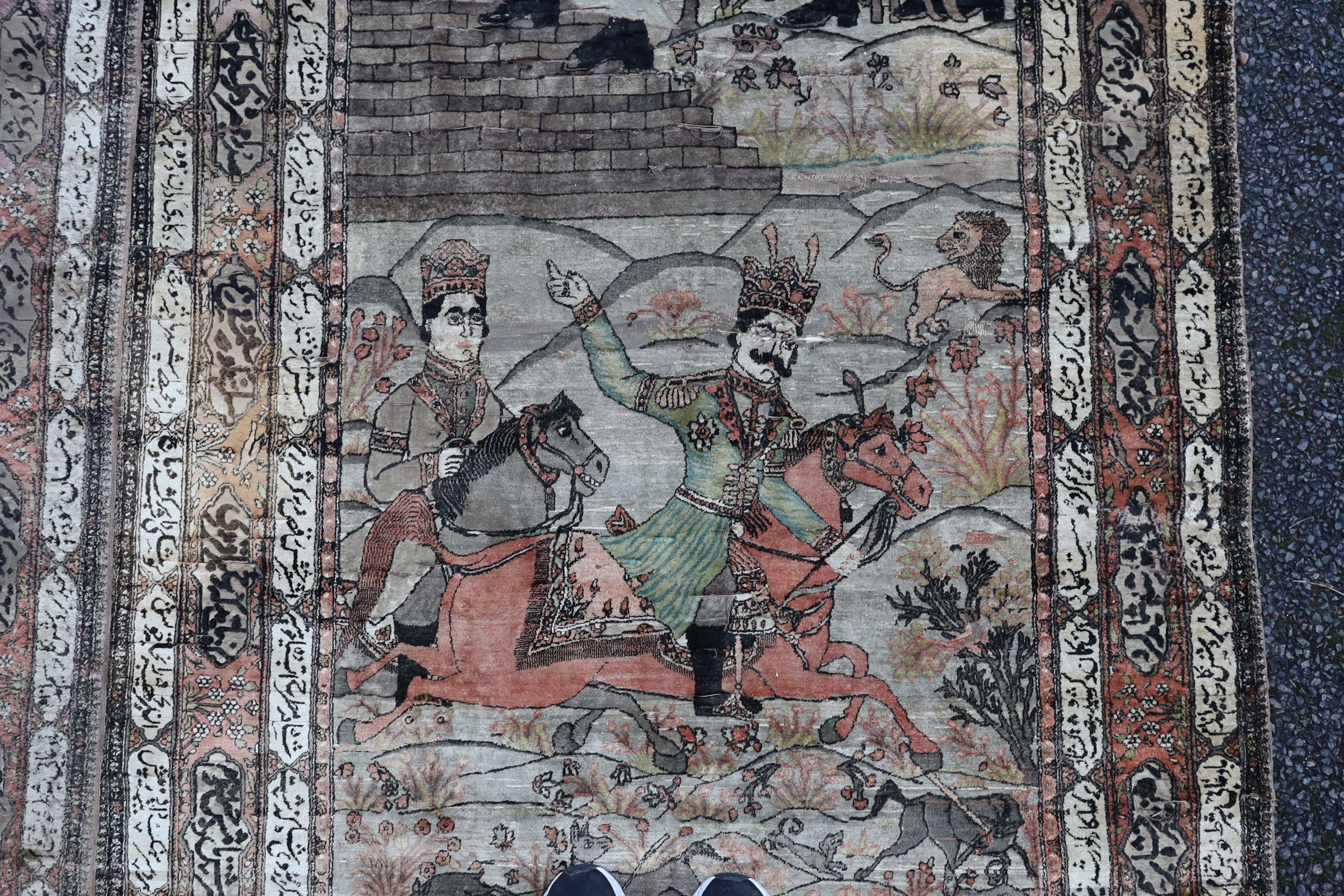 A pair of late 19th/ early 20th century Kashan silk pictorial rugs, woven with nobleman over hunters on horseback. 220 x 130cm.